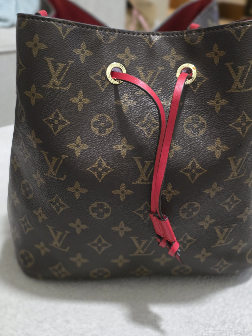 Louis Vuitton Monogram Canvas Drawstring Bucket Bag in Brown with Pink Trim